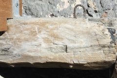 M13) Bell chamber, against east wall.  A letter H on a timber of the bell frame.