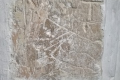 Markings on stone on exterior of alcove