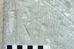 Faint human face from a compass-drawn circle, north aisle 2nd pillar from the west-northeast face